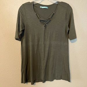 Short sleeve v neck shirt with cross cross design along neckline